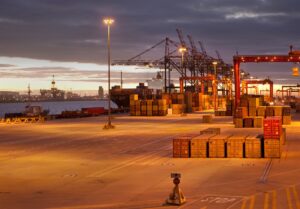 Cranes and containers in shipyard